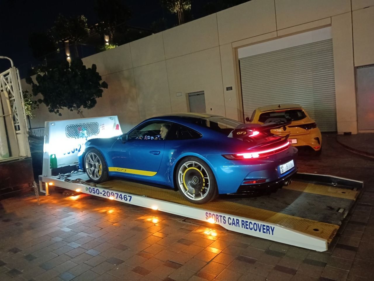 Ahmed Car Recovery flatbed recovery truck at work in Dubai — real job photo 02