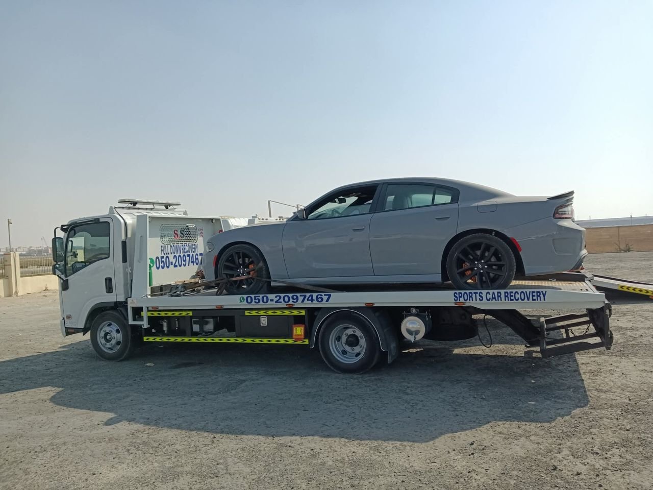 Ahmed Car Recovery flatbed recovery truck at work in Dubai — real job photo 03
