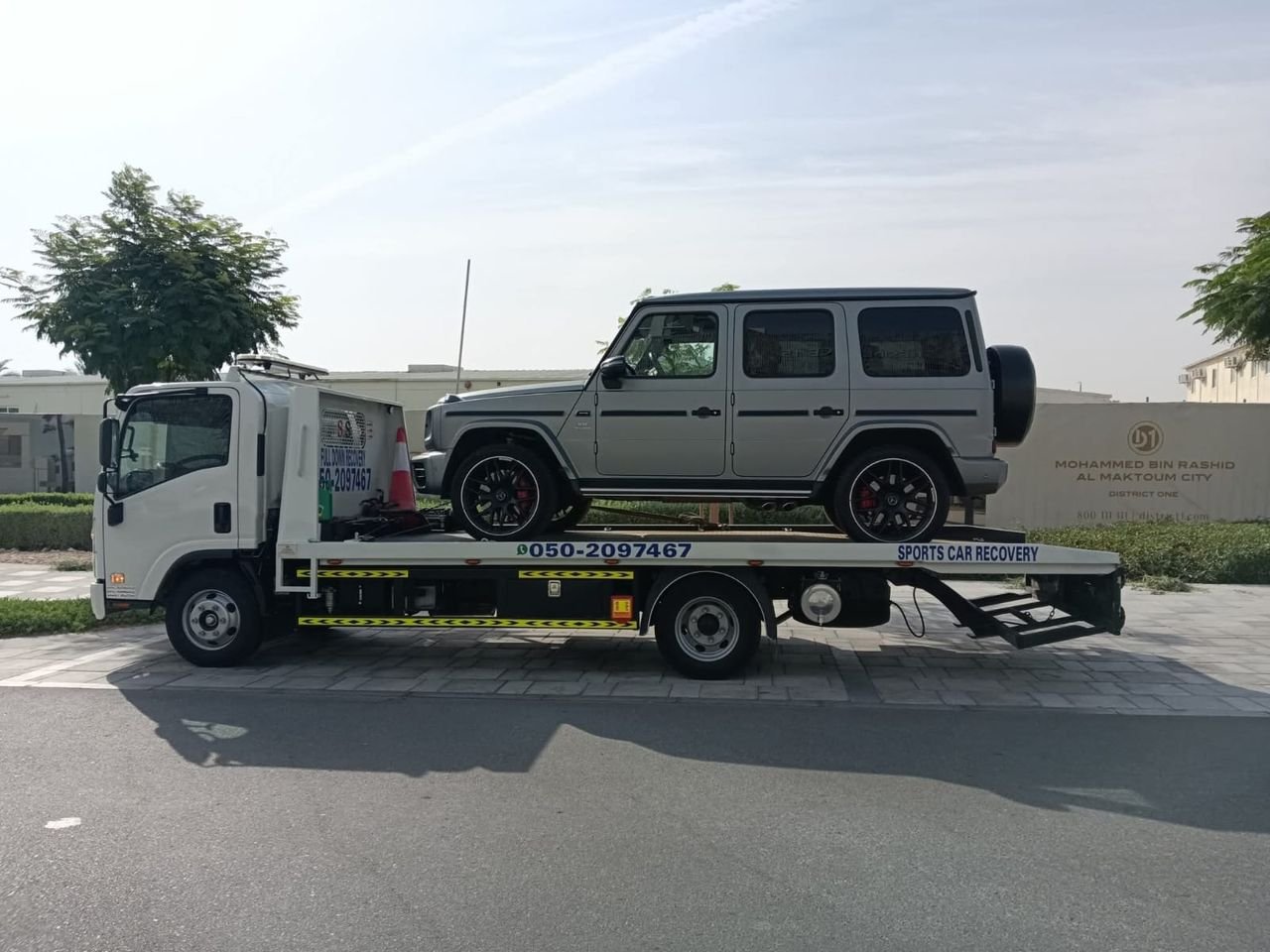 Ahmed Car Recovery flatbed recovery truck at work in Dubai — real job photo 04