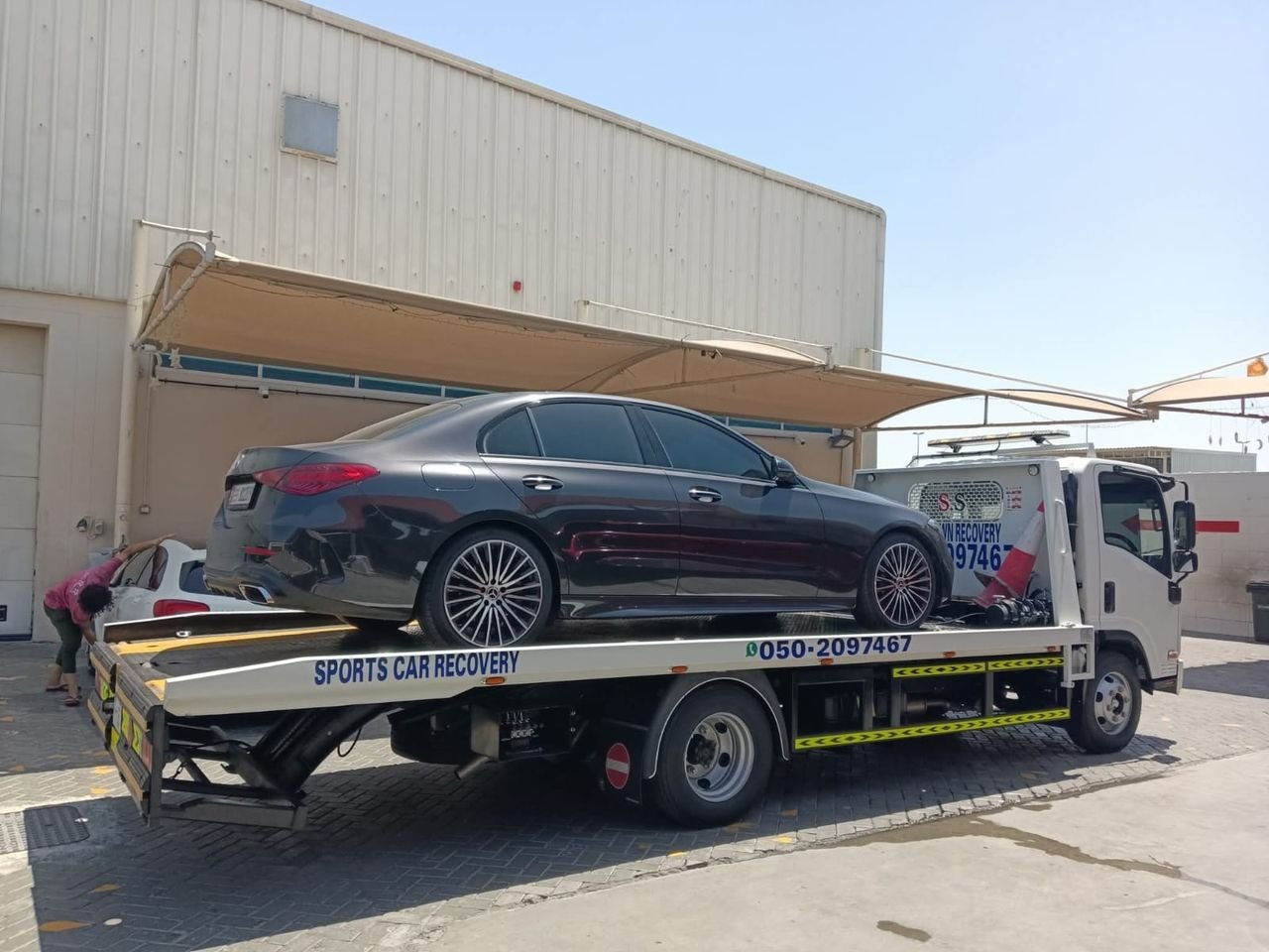 Ahmed Car Recovery flatbed recovery truck at work in Dubai — real job photo 05
