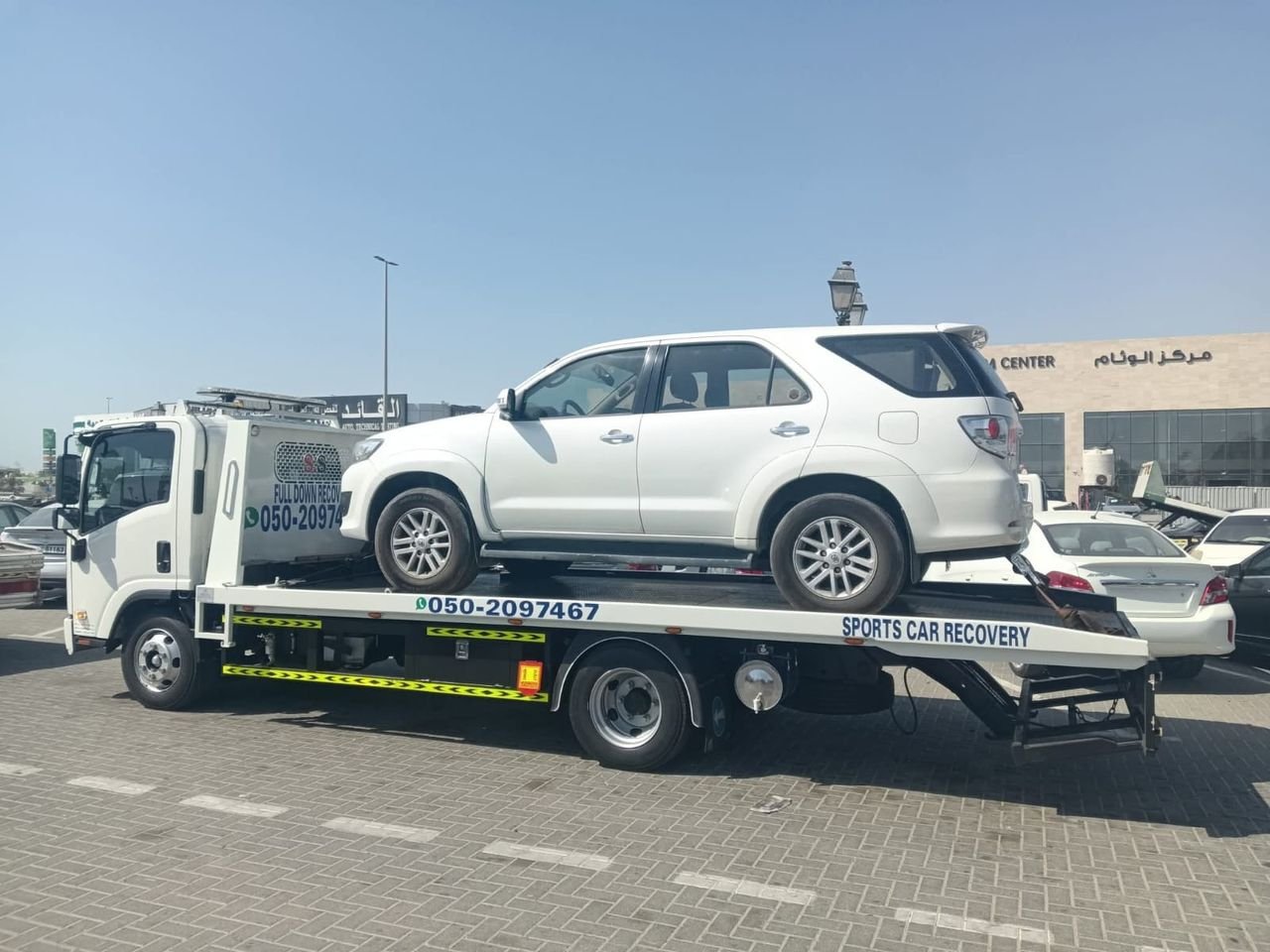 Ahmed Car Recovery flatbed recovery truck at work in Dubai — real job photo 07