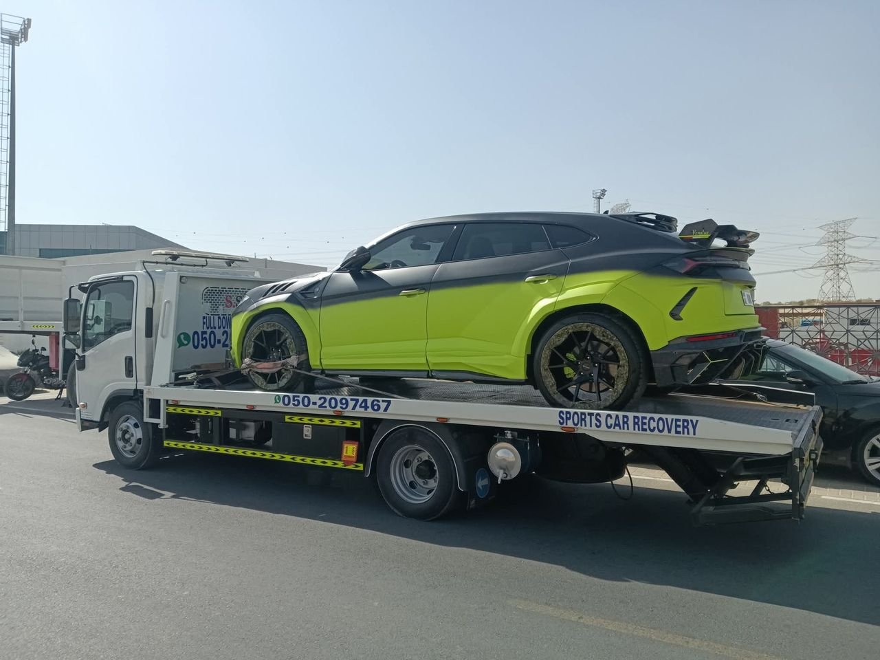 Ahmed Car Recovery flatbed recovery truck at work in Dubai — real job photo 08