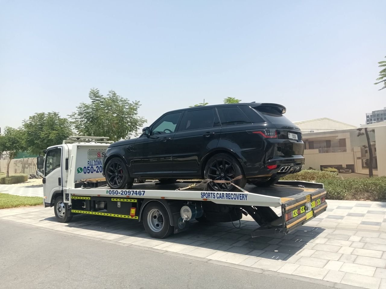 Ahmed Car Recovery flatbed recovery truck at work in Dubai — real job photo 09