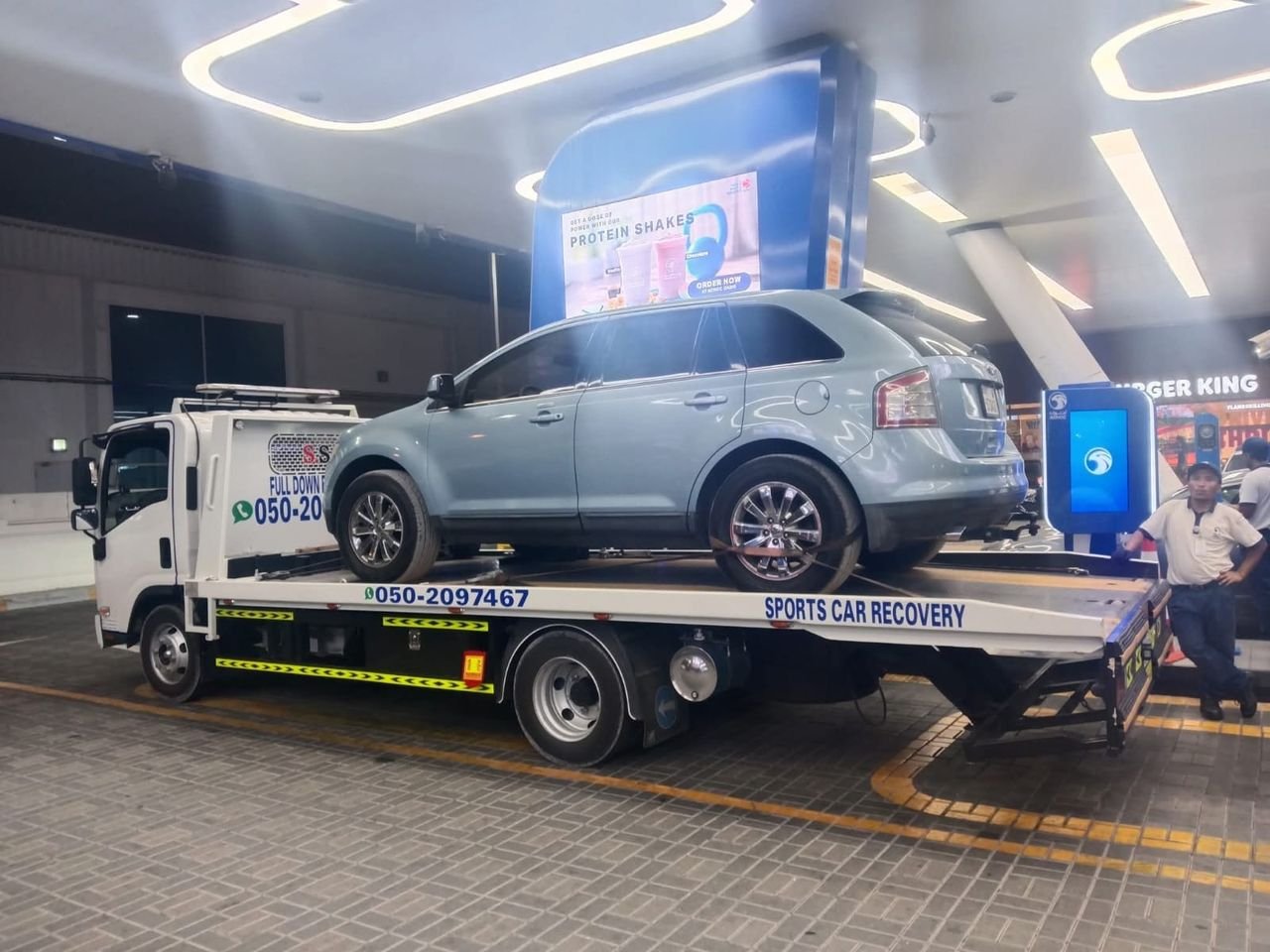 Ahmed Car Recovery flatbed recovery truck at work in Dubai — real job photo 11