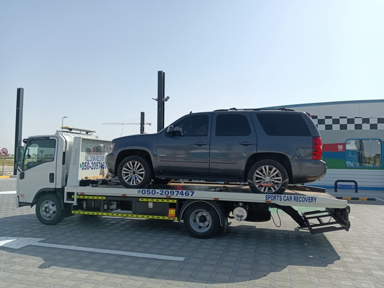 Ahmed Car Recovery flatbed recovery truck at work in Dubai — real job photo 12