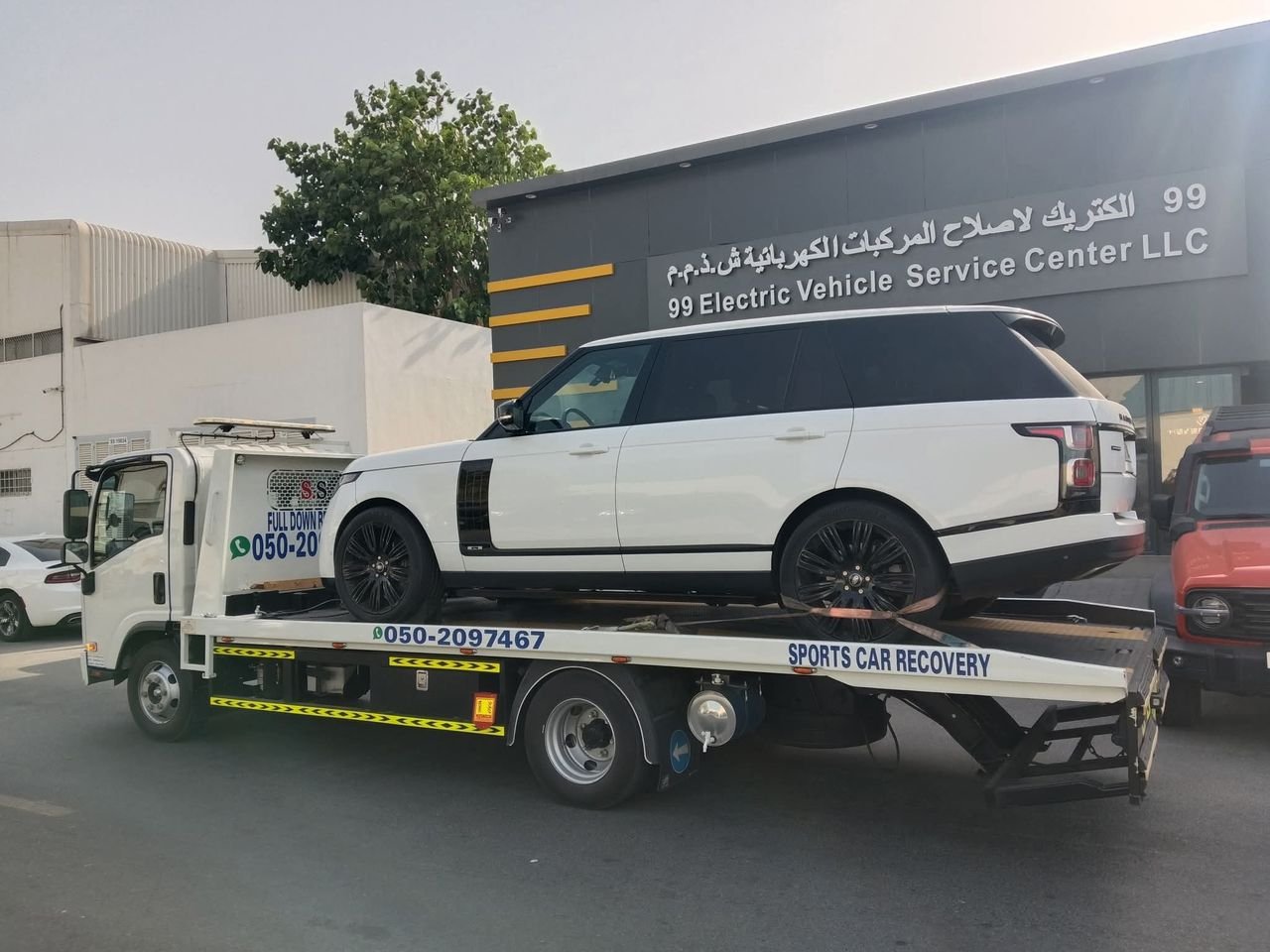 Ahmed Car Recovery flatbed recovery truck at work in Dubai — real job photo 13