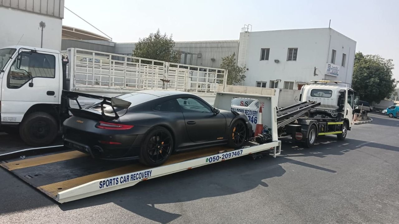 Ahmed Car Recovery flatbed recovery truck at work in Dubai — real job photo 14