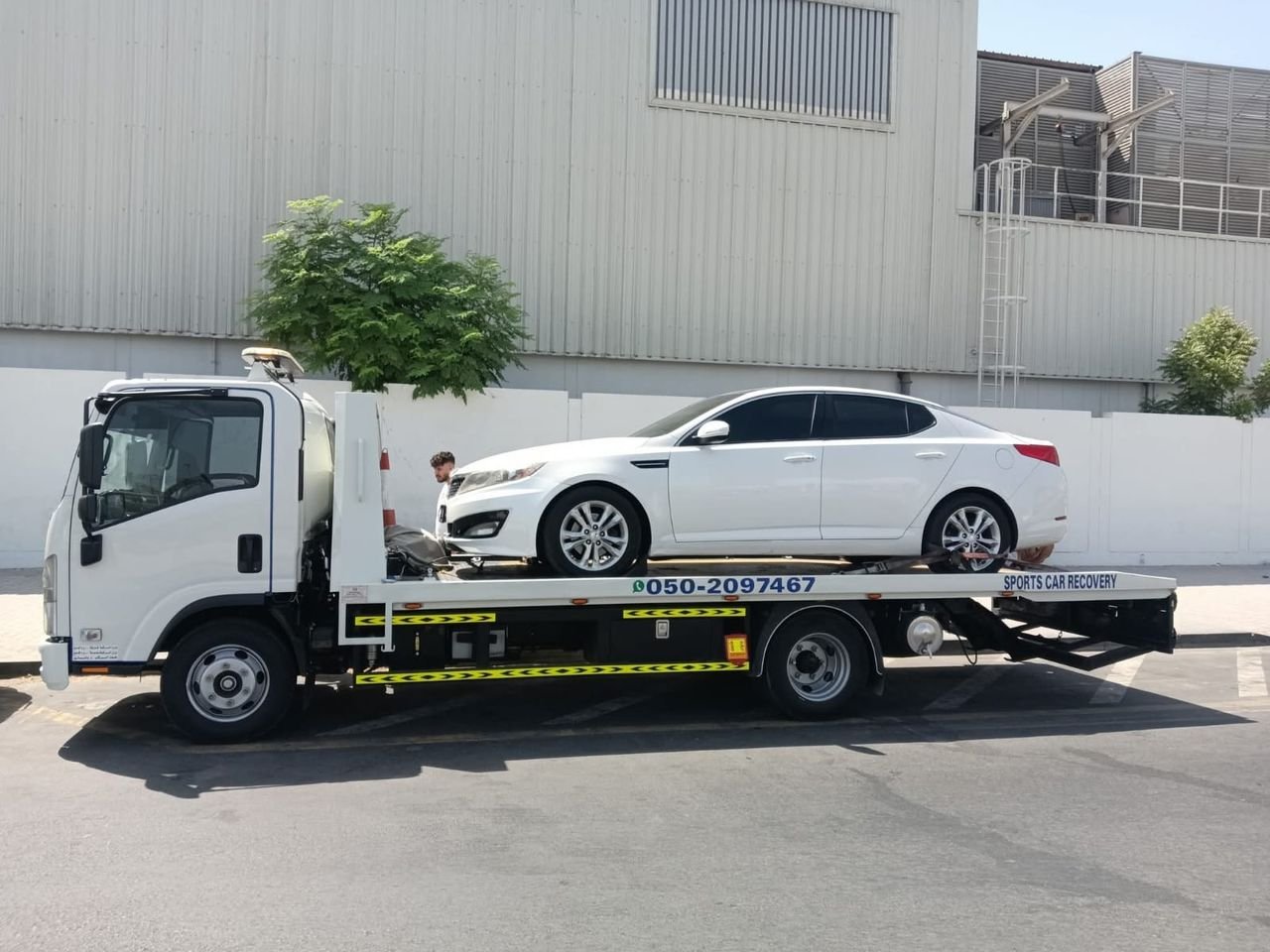 Ahmed Car Recovery flatbed recovery truck at work in Dubai — real job photo 16