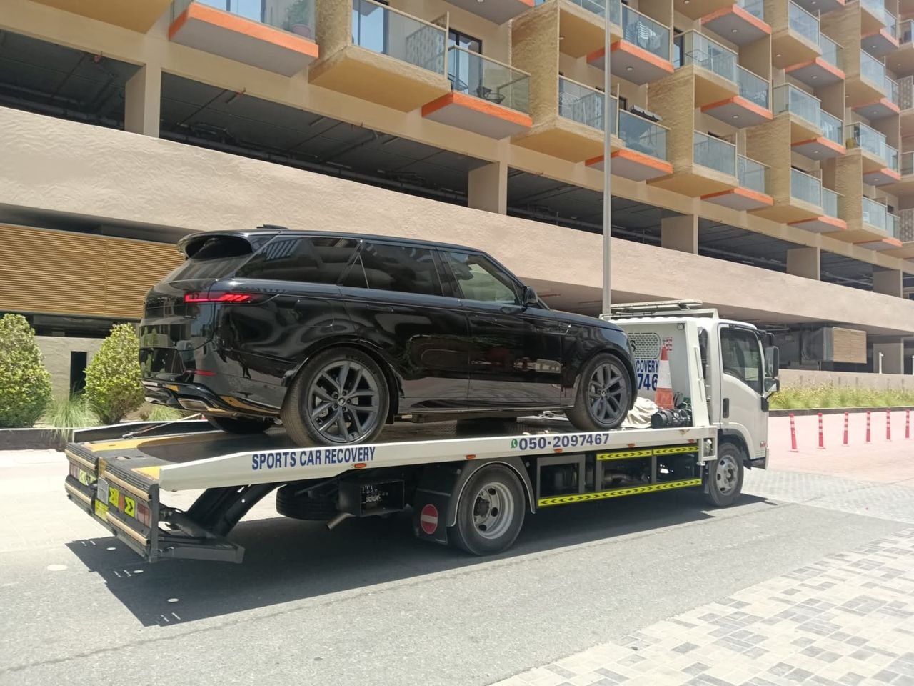 Ahmed Car Recovery flatbed recovery truck at work in Dubai — real job photo 18