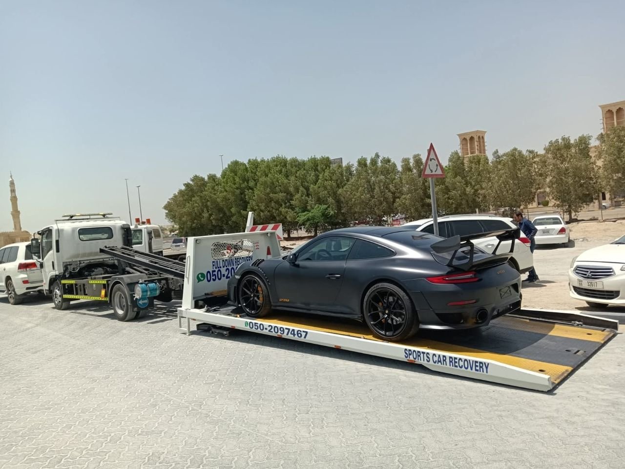 Ahmed Car Recovery flatbed recovery truck at work in Dubai — real job photo 19