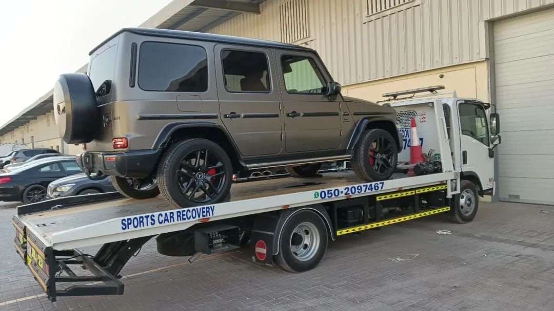 Ahmed Car Recovery flatbed recovery truck at work in Dubai — real job photo 29