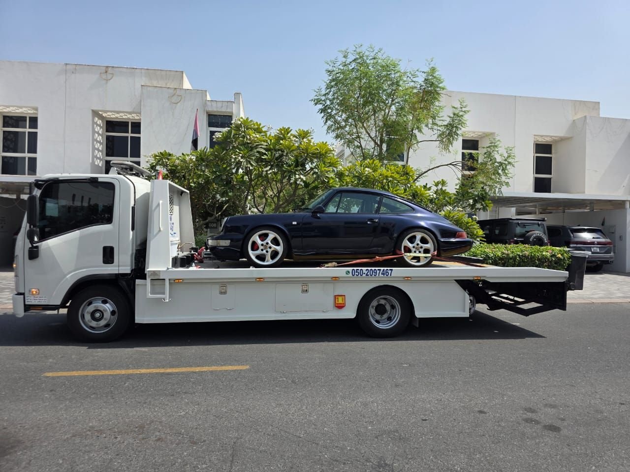 Ahmed Car Recovery flatbed recovery truck at work in Dubai — real job photo 30