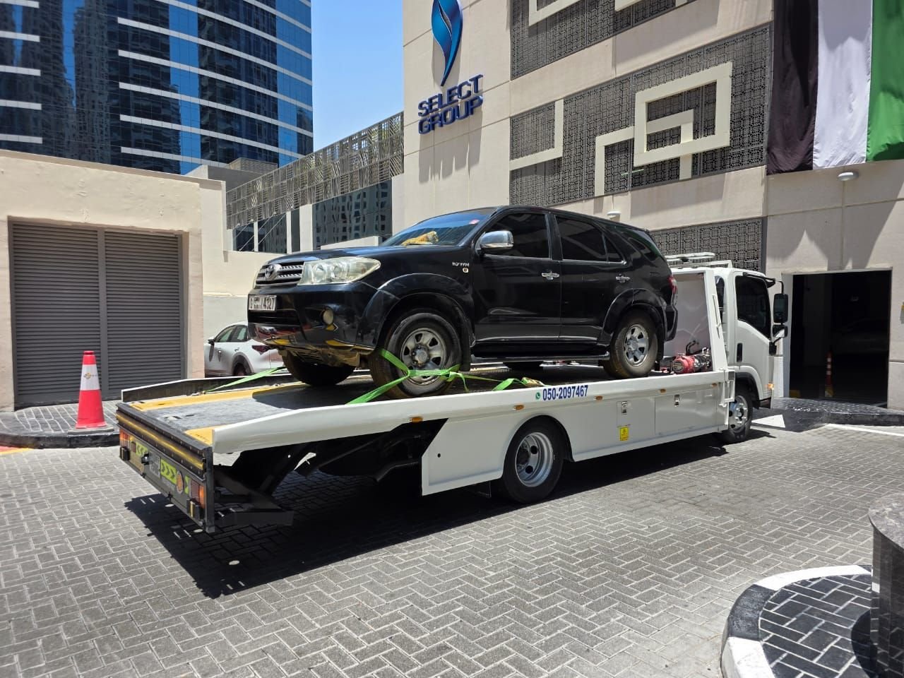 Ahmed Car Recovery flatbed recovery truck at work in Dubai — real job photo 32