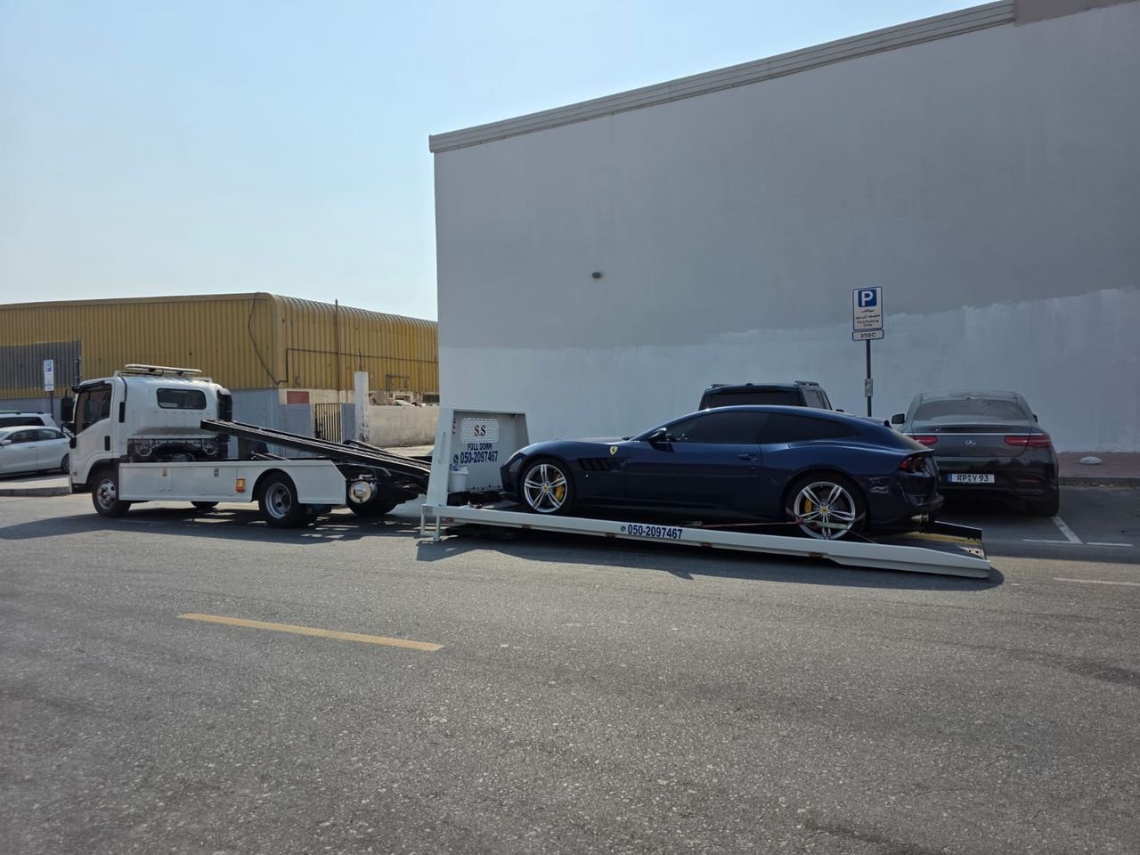 Ahmed Car Recovery flatbed recovery truck at work in Dubai — real job photo 33