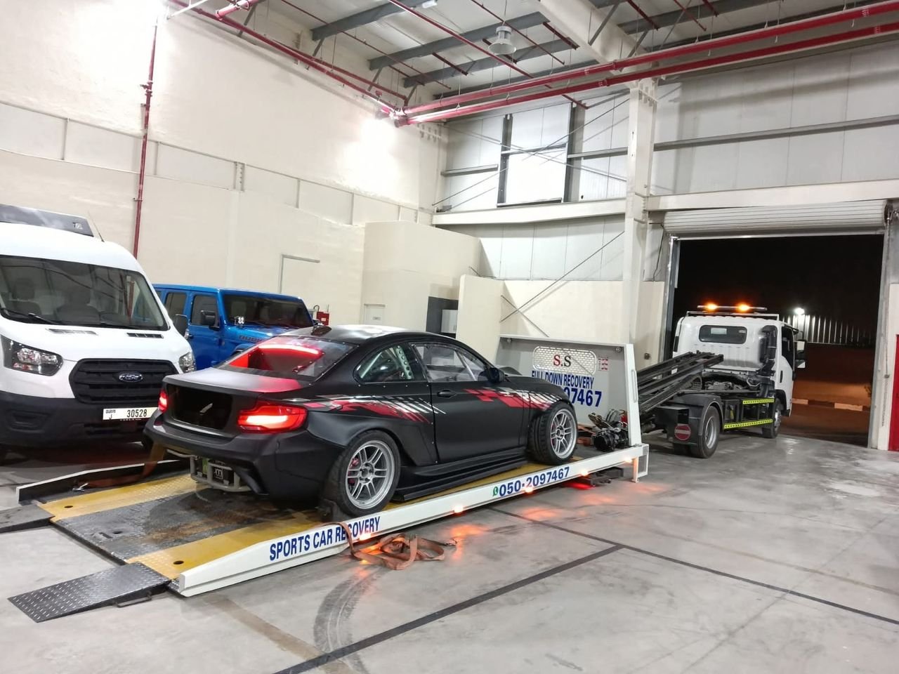 Ahmed Car Recovery flatbed recovery truck at work in Dubai — real job photo 35