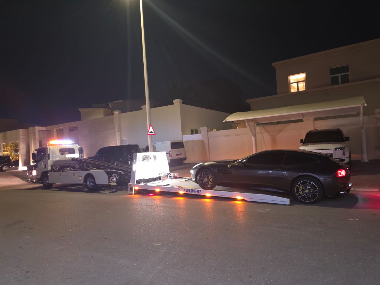 Car towing Dubai — pickup truck being loaded