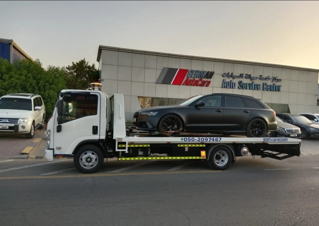 Flatbed towing Dubai — vehicle strapped securely