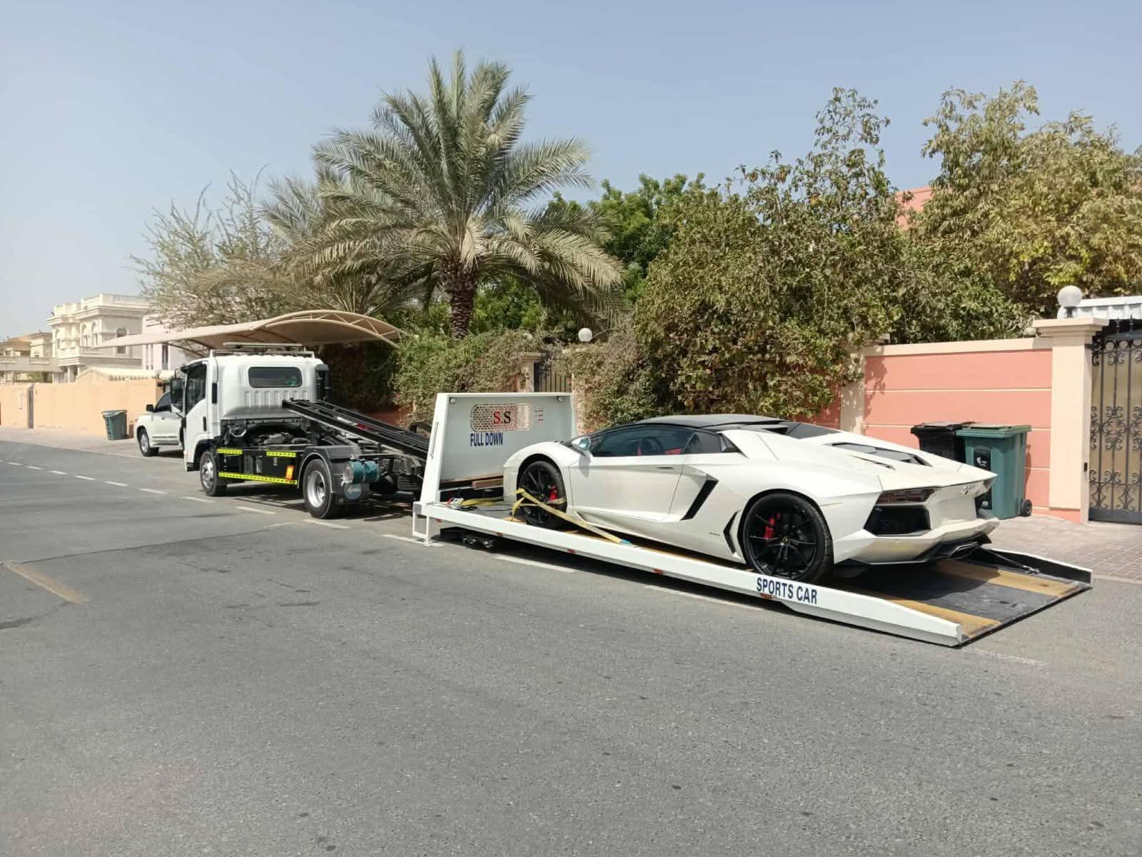 Flatbed towing Dubai truck side profile view