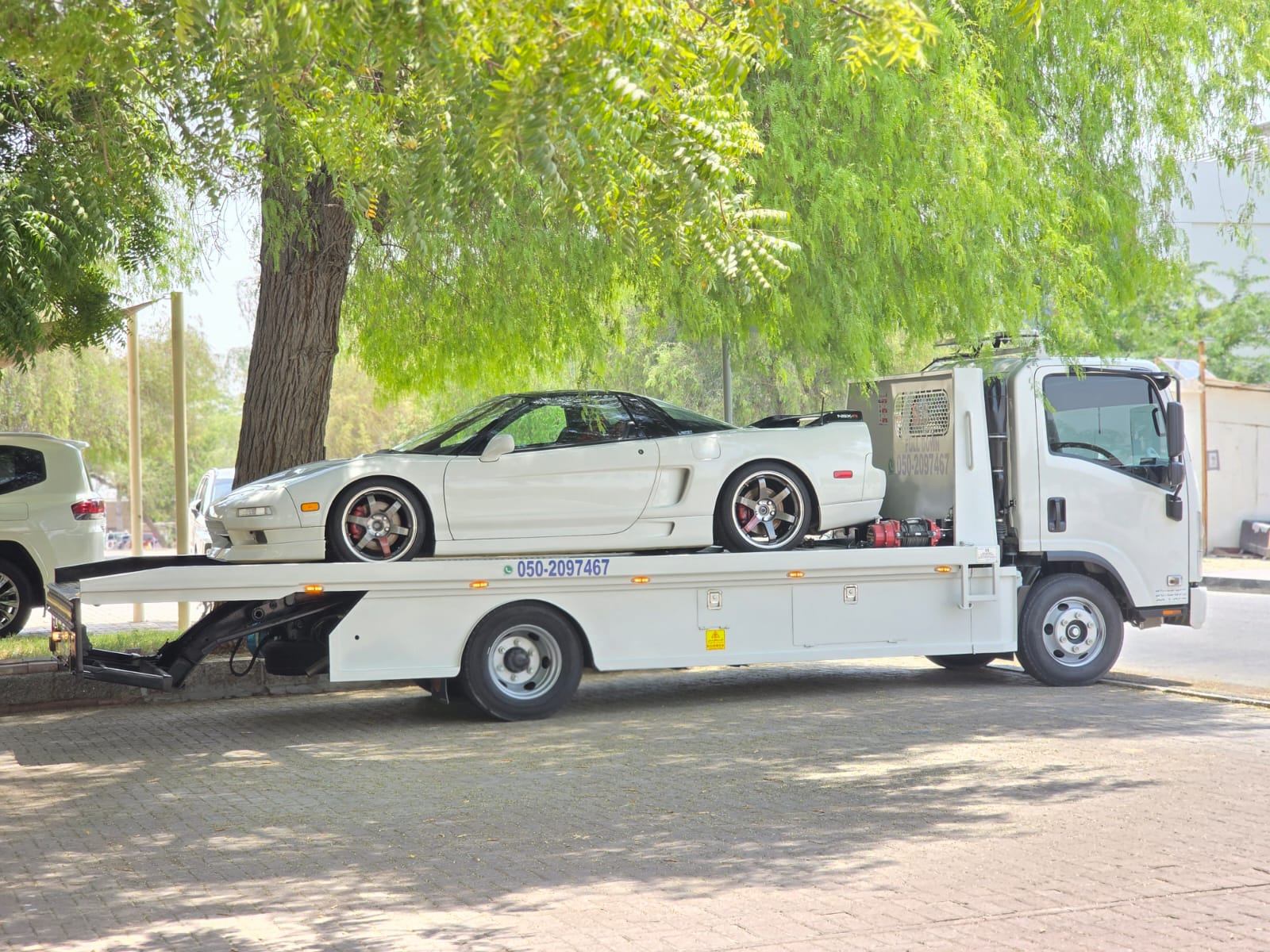 Sports car recovery Dubai — Honda NSX white on flatbed